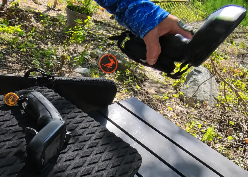 Liftfoils eFoil hand controller with color coded Verdant Ride logo tags.