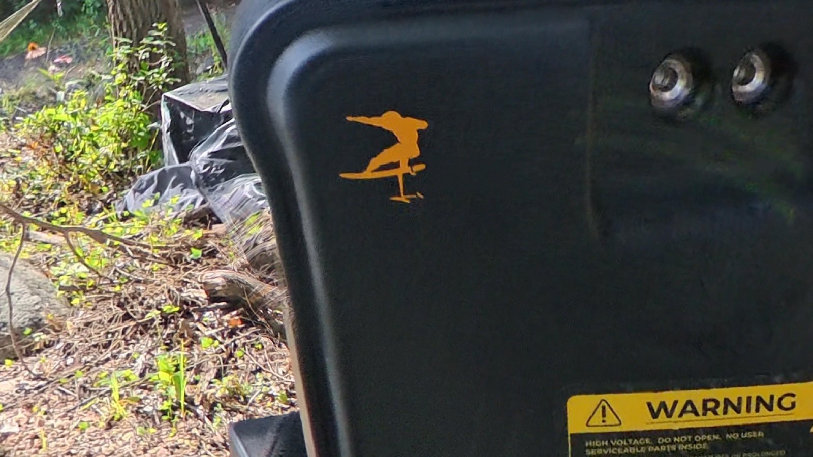 Lift eFoil battery lid with a large Verdant Ride logo and wordmark, lake in the background